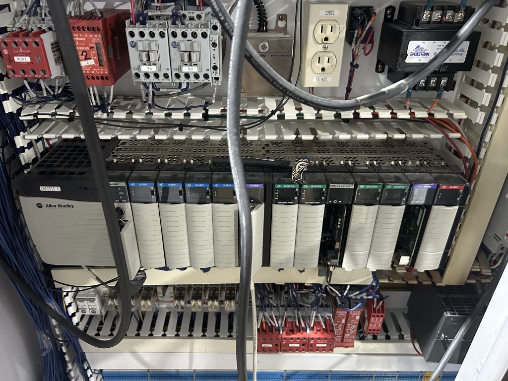 Allen-Bradley control panel at Natural Way Food Group showing PLC modules and contactors